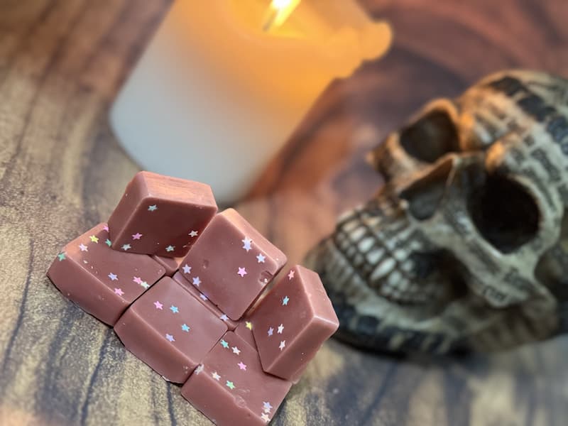 Autumnal wax melts with candle and skull background